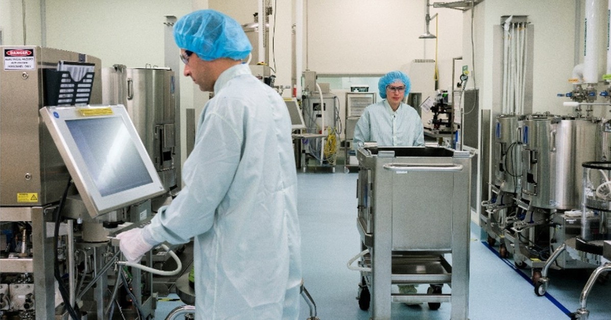 BioCina manufacturing personnel operating equipment in a pharmaceutical production facility supporting integrated mRNA and LNP manufacturing